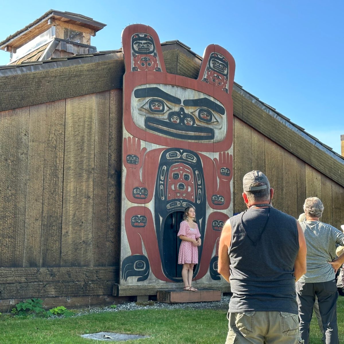 a group of people standing in front of a building