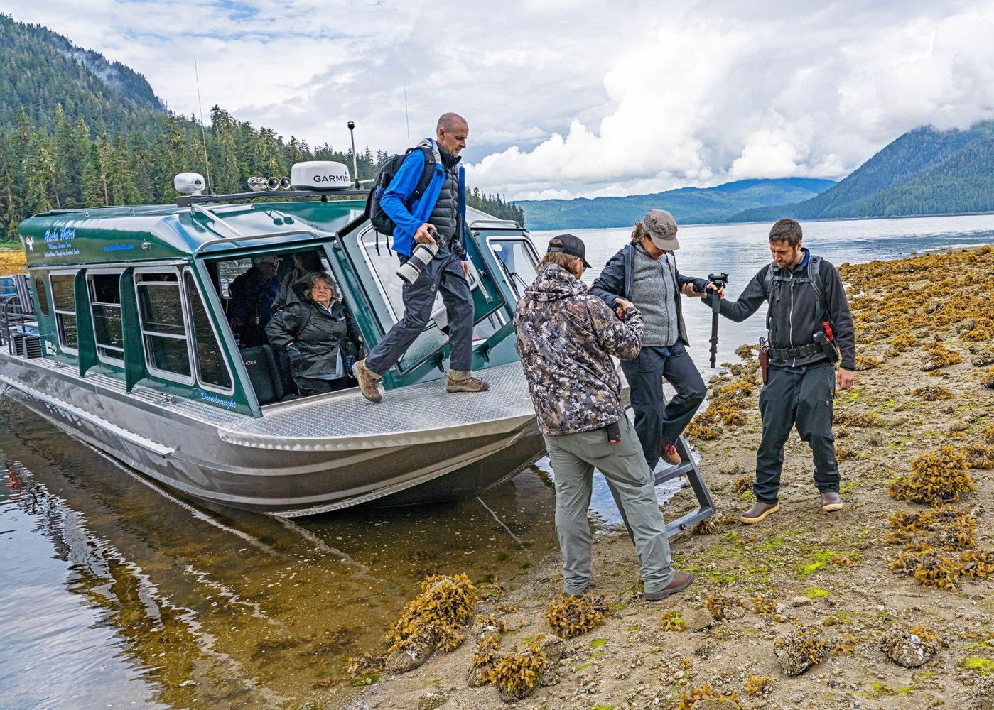 a group of people on a boat in the water