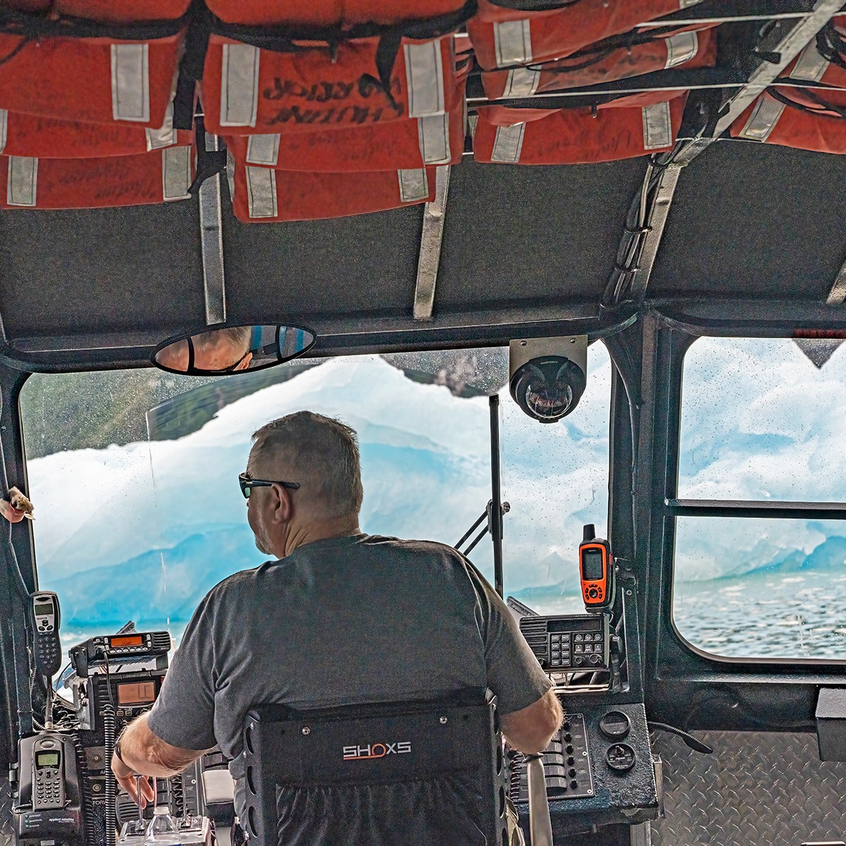 a person riding on the back of a boat